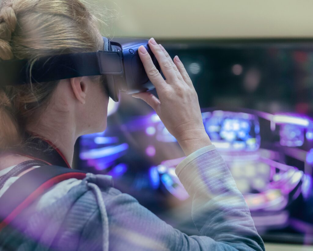Young woman is in virtual reality wearing VR glasses. Future technology concept
